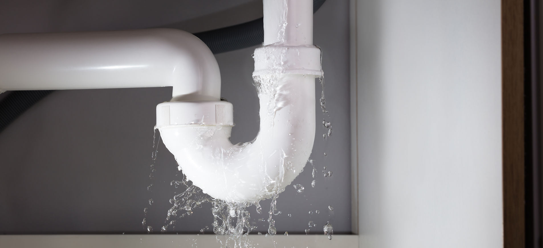 Professional plumbing work being performed